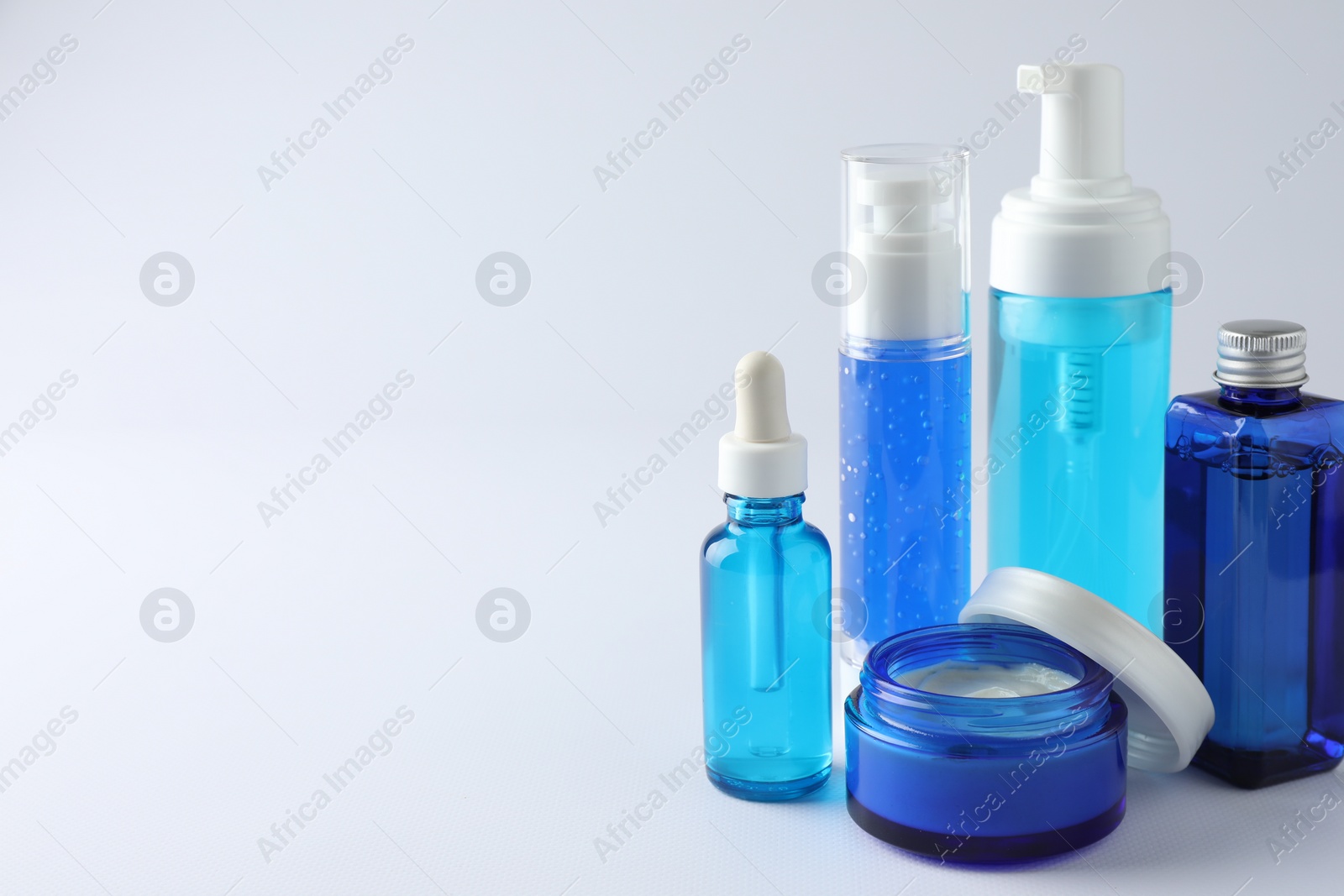 Photo of Set of luxury cosmetic products on white background. Space for text