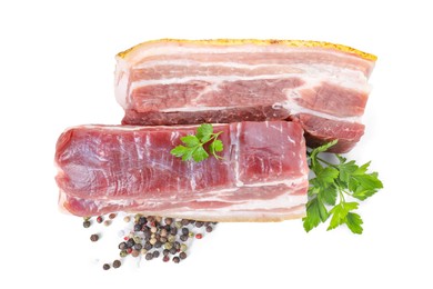 Photo of Pieces of raw pork belly, peppercorns and parsley isolated on white, top view