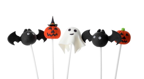 Photo of Different Halloween themed cake pops on white background