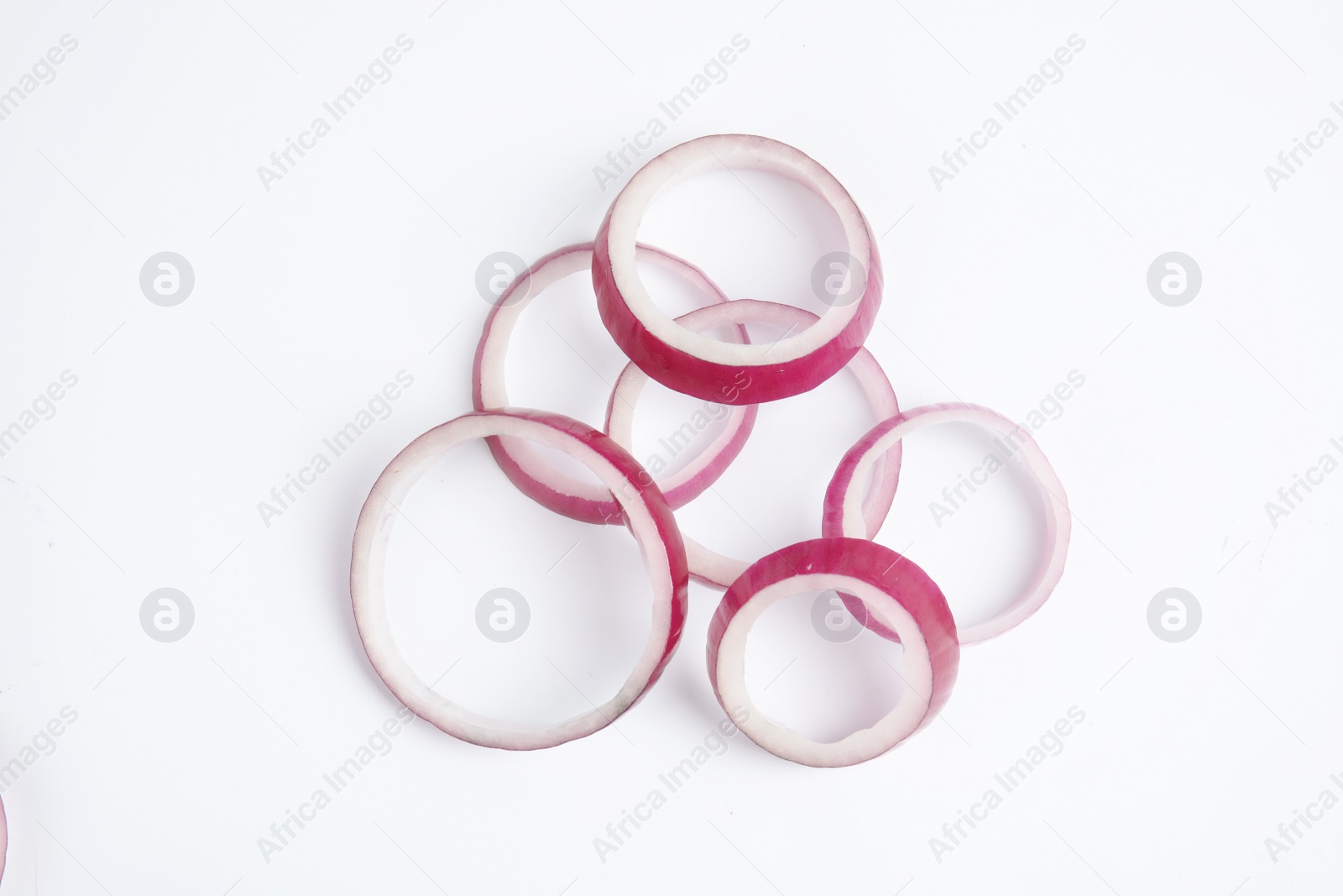 Photo of Fresh slices of red onion on white background