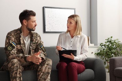 Psychologist working with military officer in office