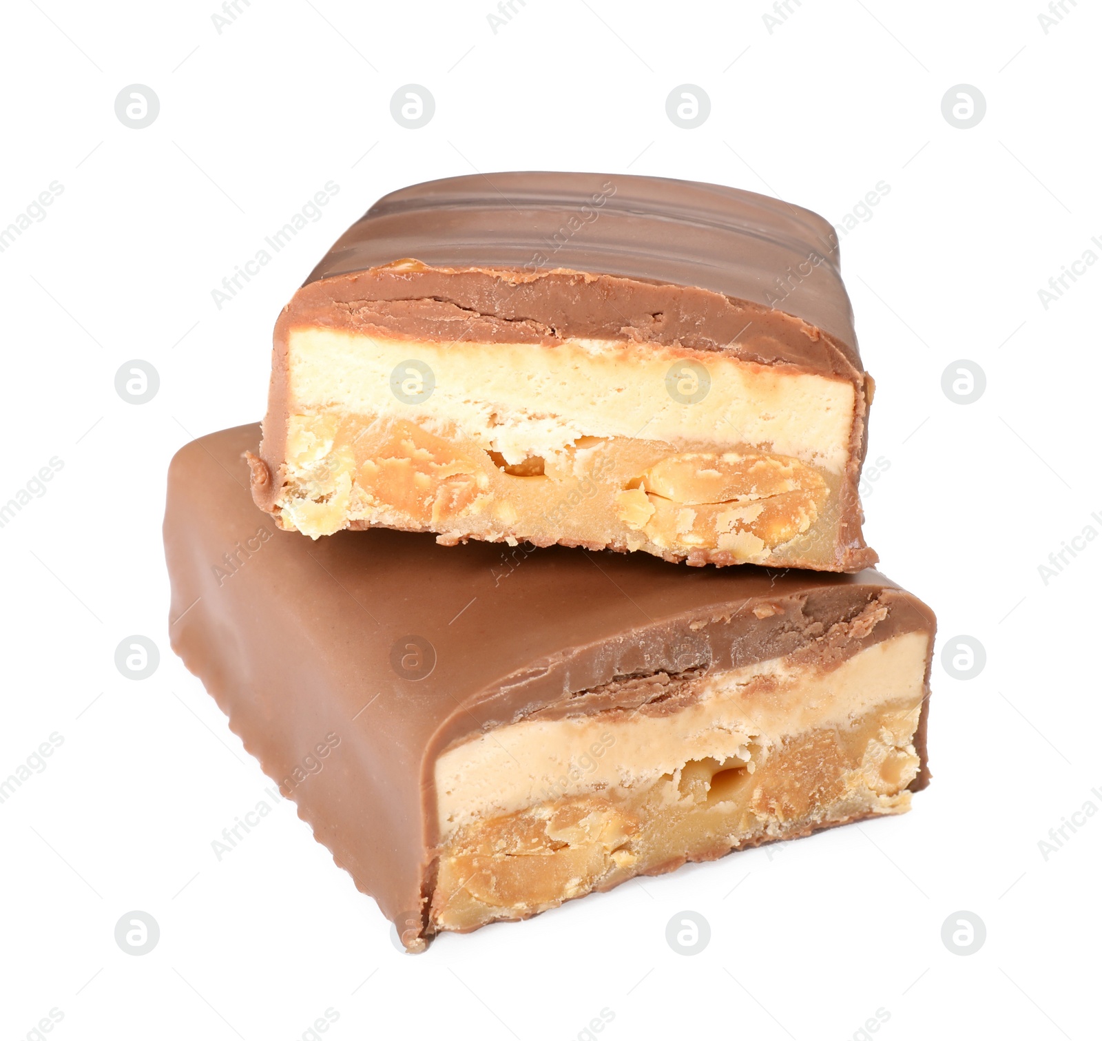 Photo of Pieces of tasty chocolate bars with nougat and nuts on white background