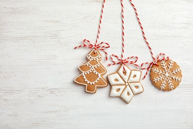 Photo of Tasty homemade Christmas cookies on wooden background