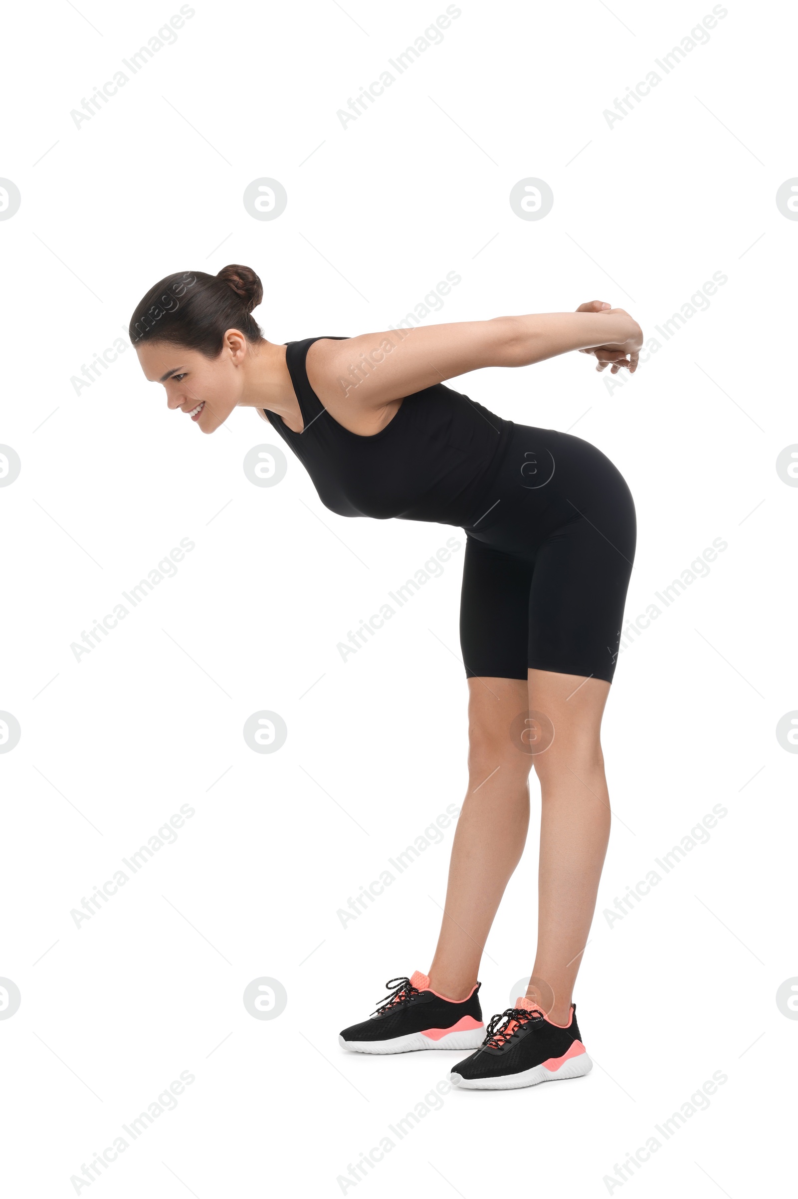 Photo of Happy woman stretching on white background. Morning exercise