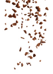 Pouring aromatic instant coffee on white background