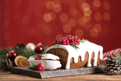 Photo of Traditional Christmas cake on wooden table. Classic recipe