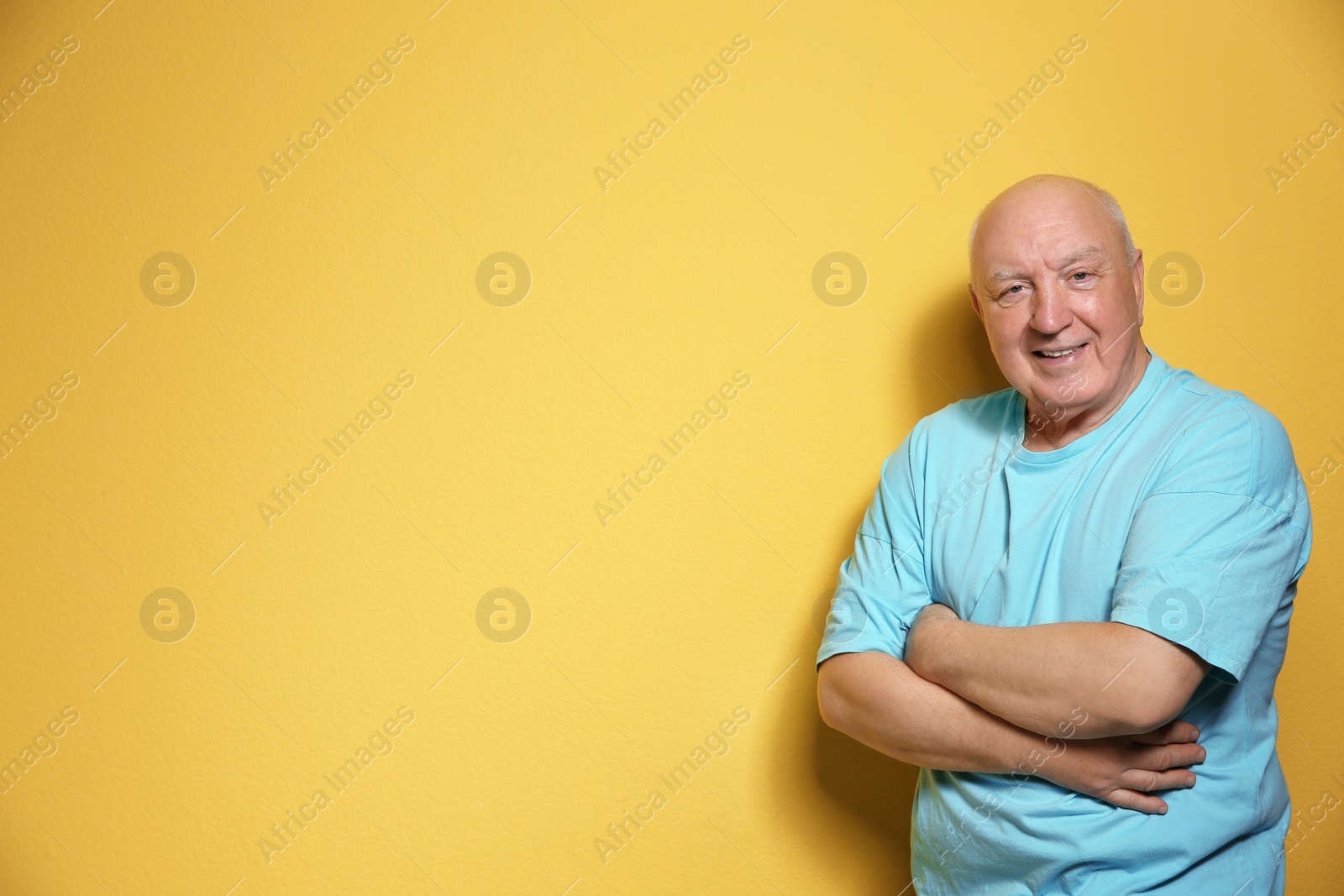 Photo of Portrait of elderly man on color background. Space for text