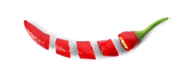 Cut red chili pepper on white background