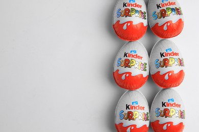 Photo of Sveti Vlas, Bulgaria - June 26, 2023: Kinder Surprise Eggs on white background, flat lay. Space for text