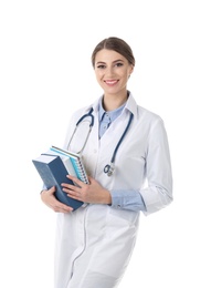 Young medical student with books on white background