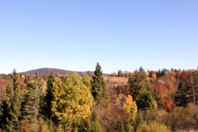 Photo of Picturesque landscape with blue sky over mountains, blurred view