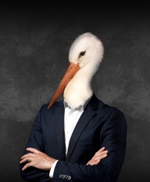 Image of Portrait of businessman with stork face on dark background