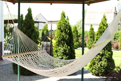 Photo of Beautiful English style garden with comfortable hammock on sunny day