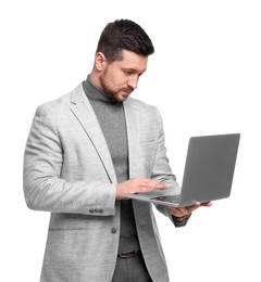 Photo of Handsome bearded businessman using laptop on white background