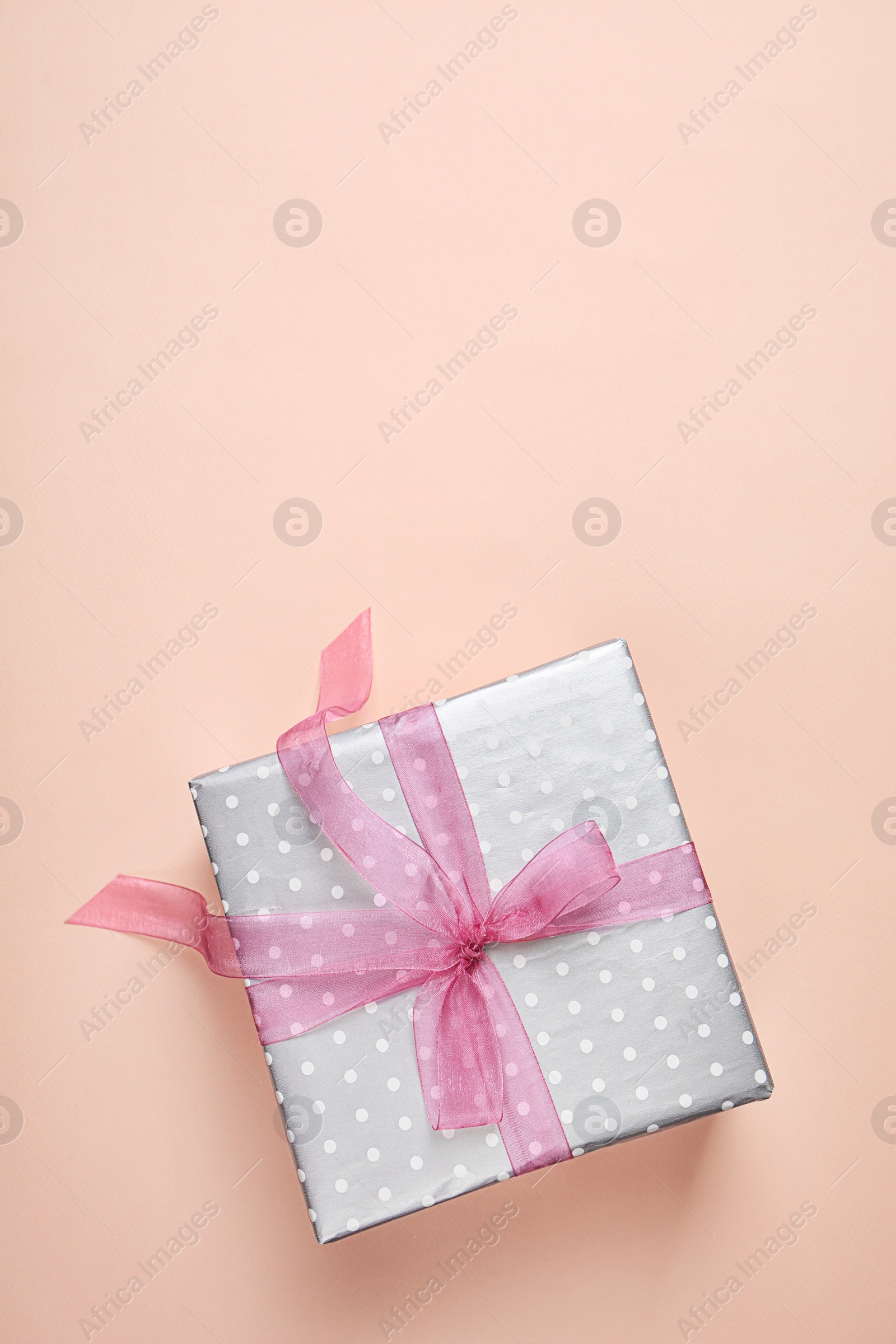 Photo of Elegant gift box for Mother's Day on color background, top view