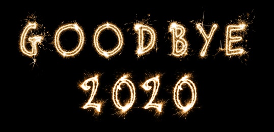  Goodbye 2020. Bright text made of sparkler on black background, banner design 