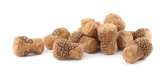 Photo of Heap of sparkling wine corks on white background