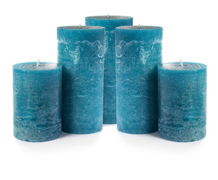 Image of Set of blue wax candles on white background