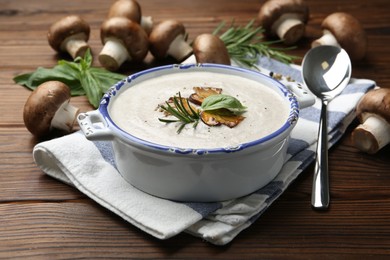 Delicious homemade mushroom soup served on wooden table
