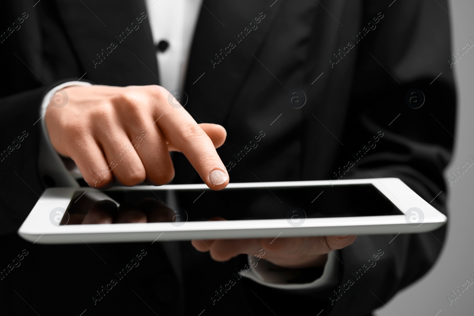 Photo of Closeup view of woman using modern tablet