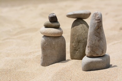 Stacks of stones on beautiful sandy beach