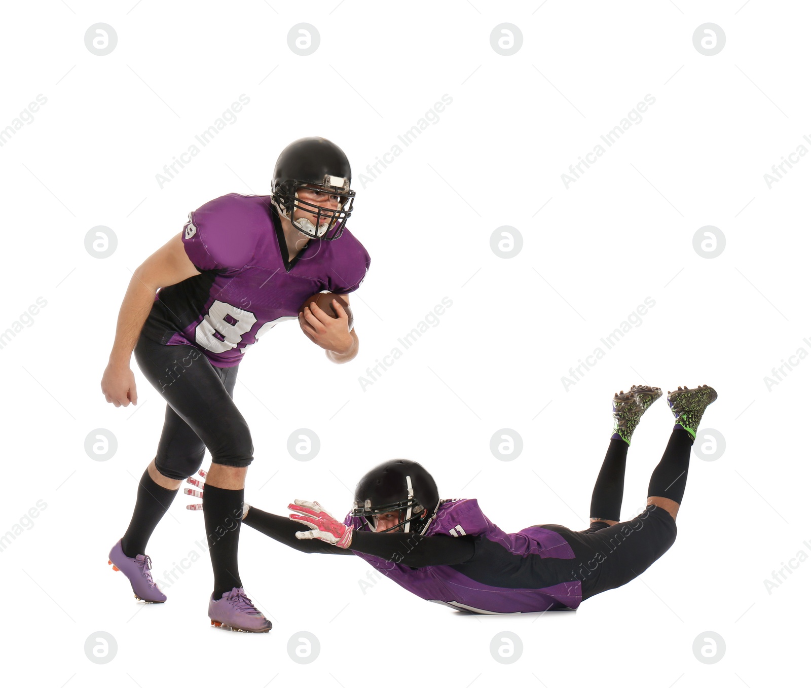 Photo of Men in uniform playing American football on white background