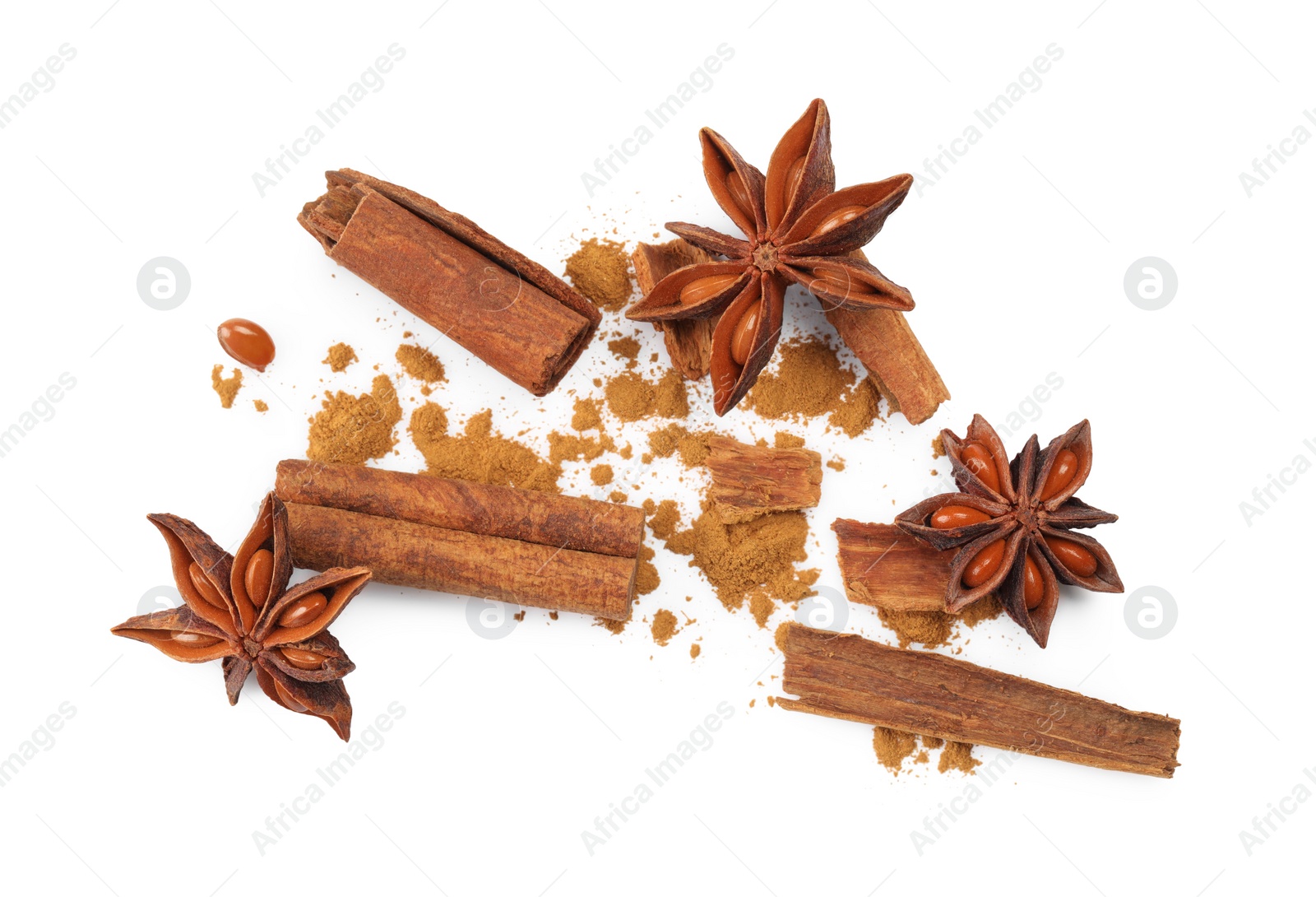 Photo of Dry aromatic cinnamon sticks, powder and anise stars isolated on white, top view