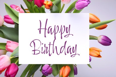 Image of Beautiful bouquet of tulip flowers with Happy Birthday card on light background, top view
