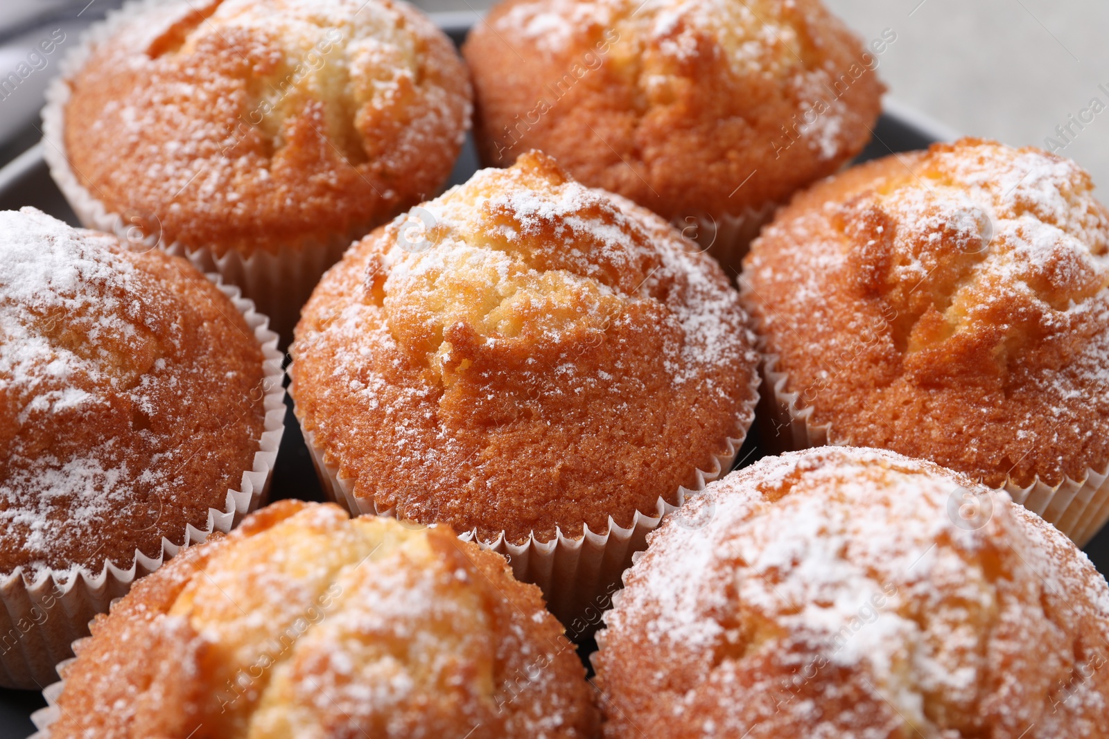 Photo of Delicious sweet muffins on table, closeup view