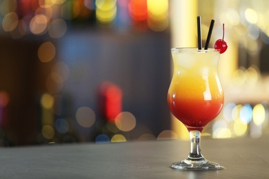 Photo of Just made appetizing cocktail Sex on the Beach in bar. Space for text