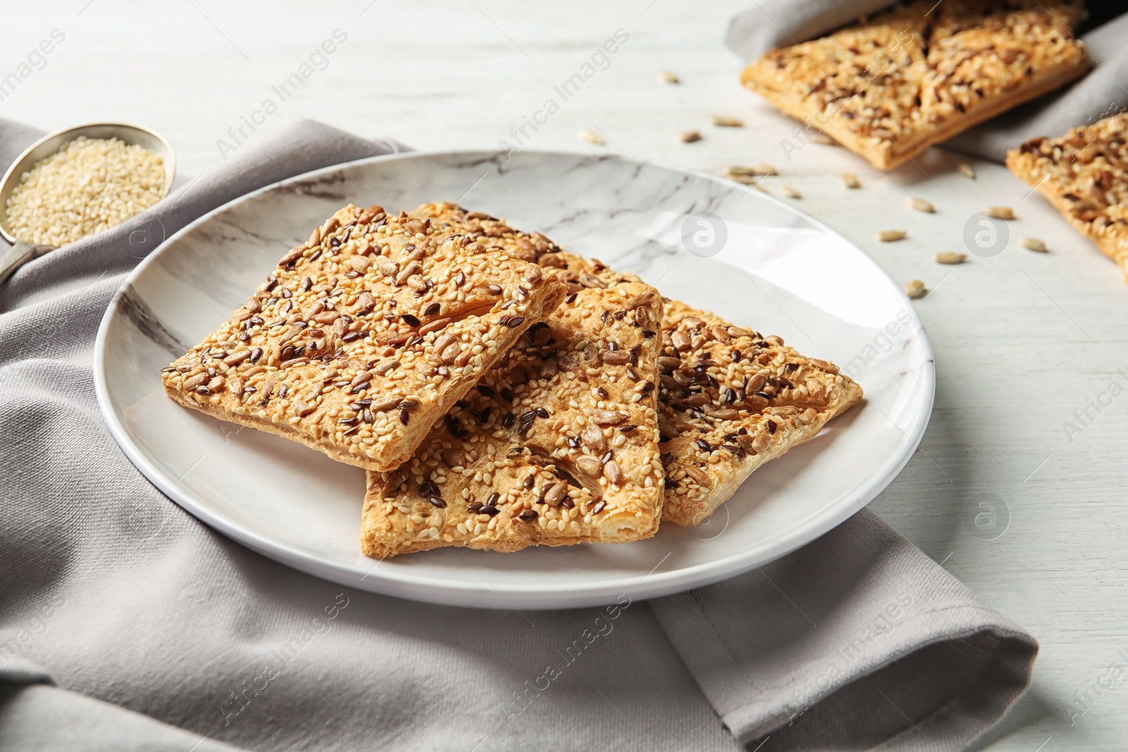 Photo of Plate with homemade grain cereal cookies on table. Healthy snack