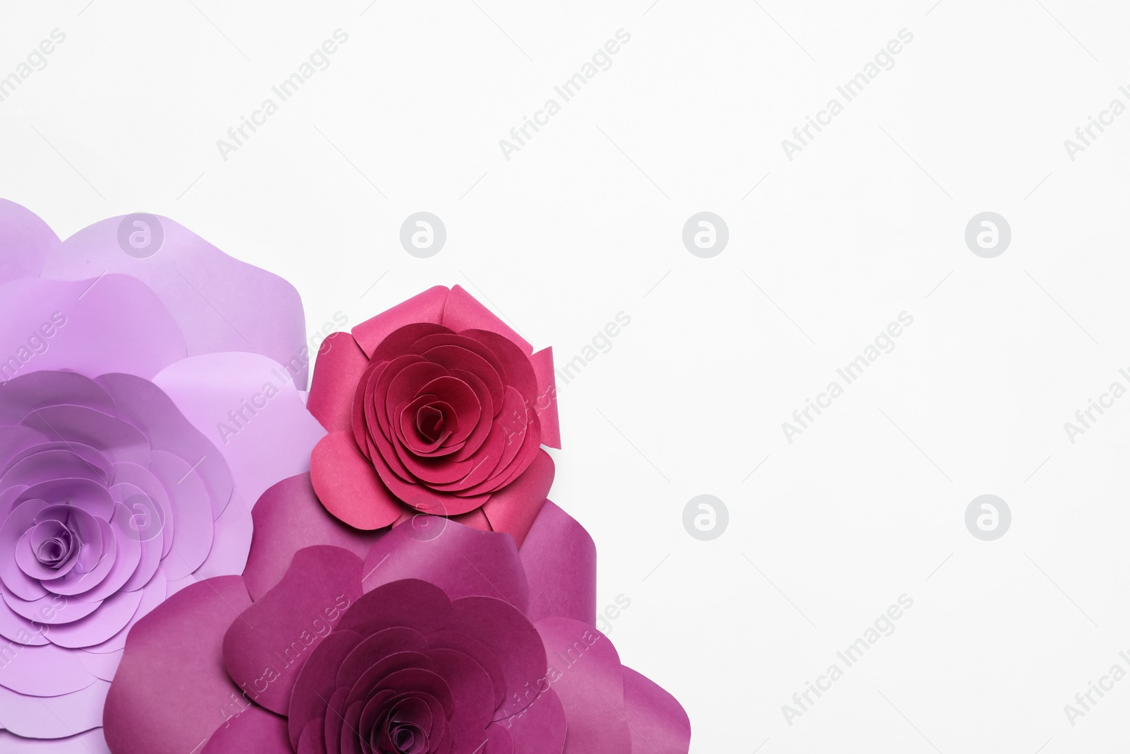 Photo of Different beautiful flowers made of paper on white background, flat lay. Space for text