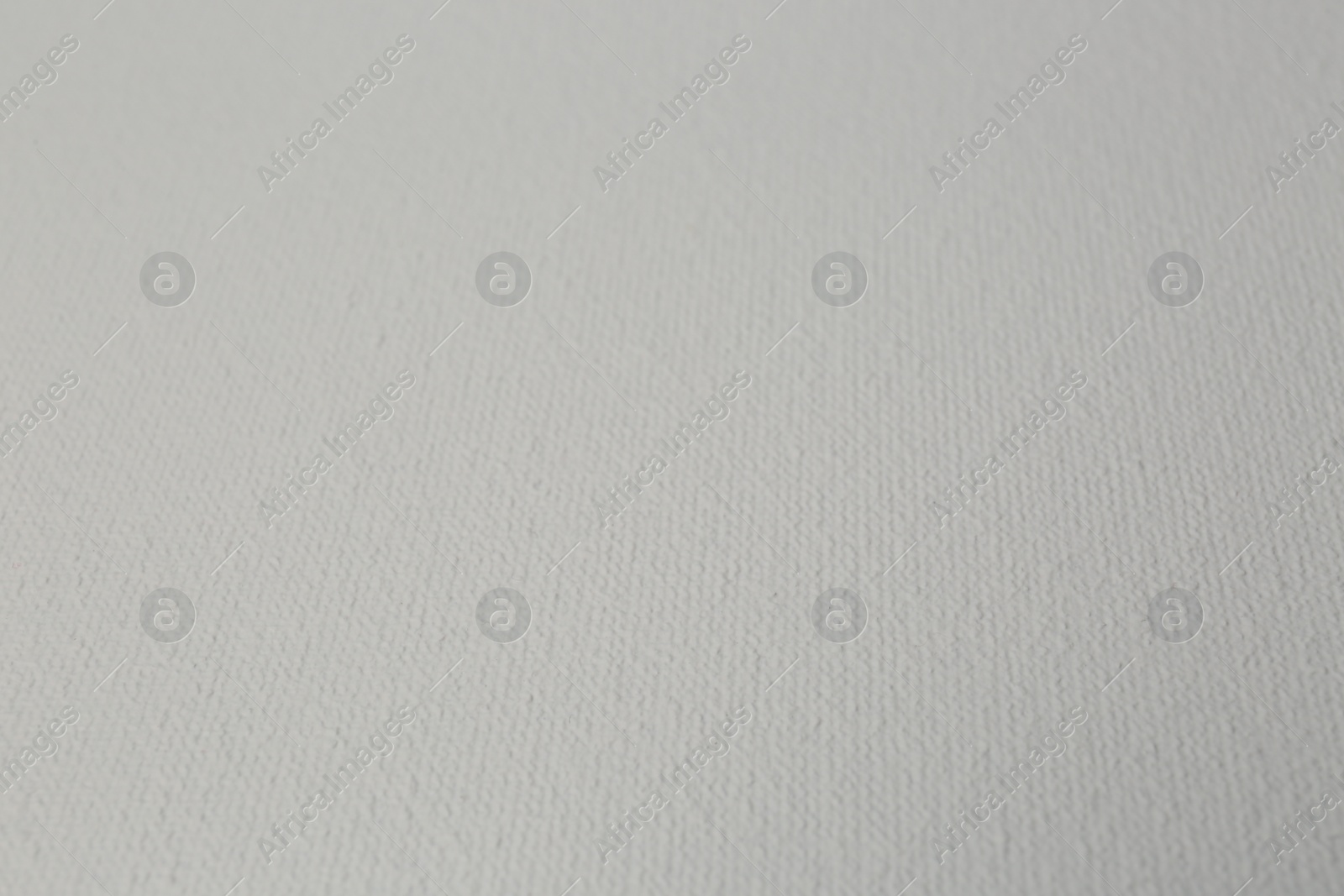 Photo of Blank white canvas as background, closeup view