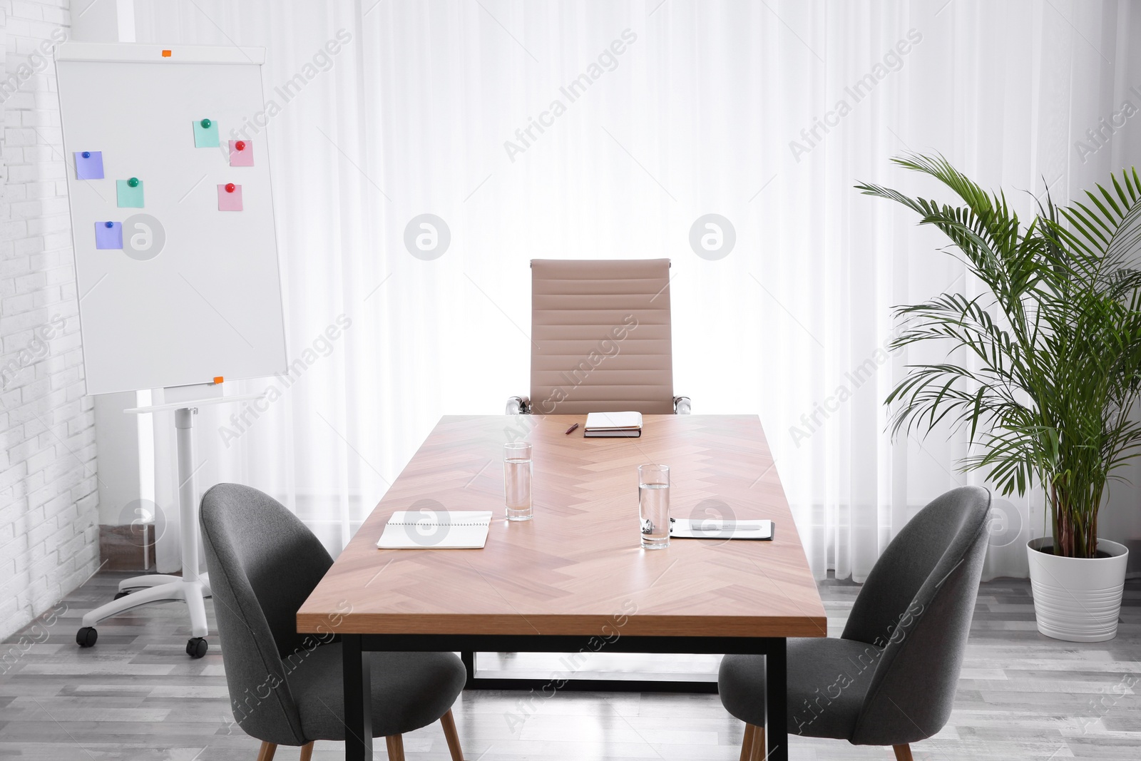 Photo of Interior of modern office with table and chairs