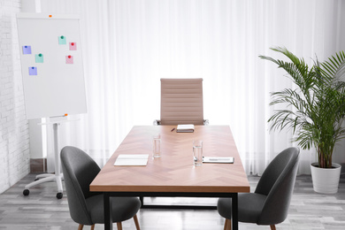 Photo of Interior of modern office with table and chairs