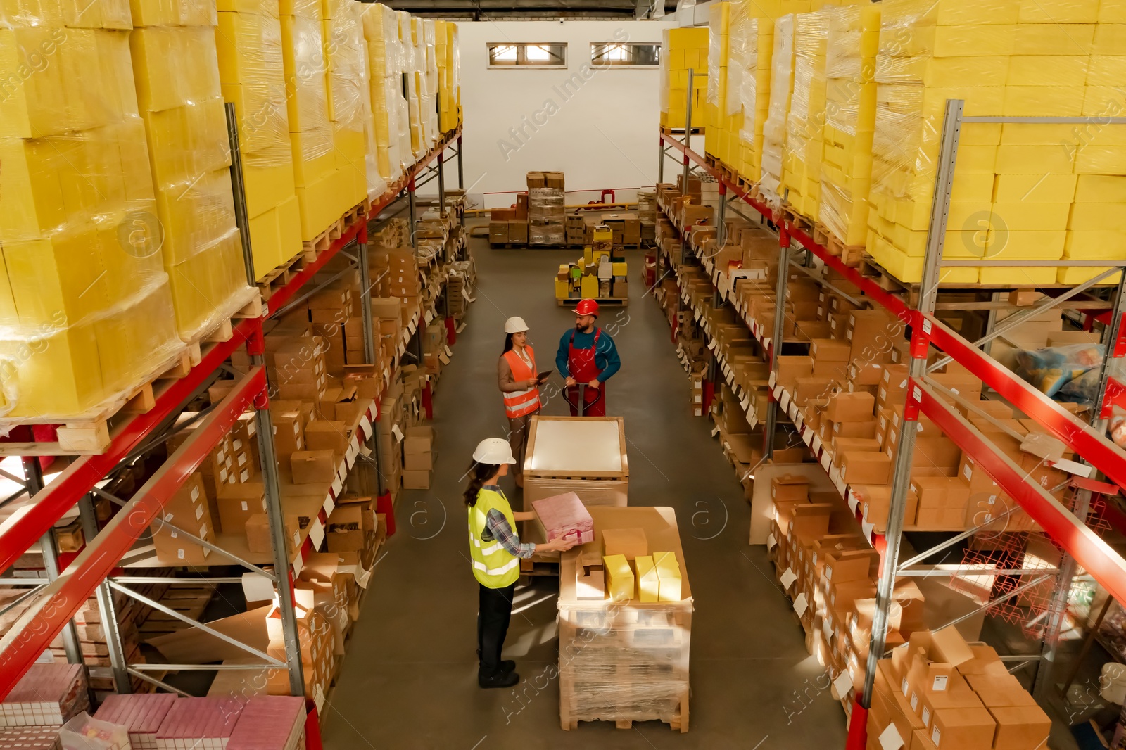 Image of Manager and workers at warehouse, above view. Logistics center