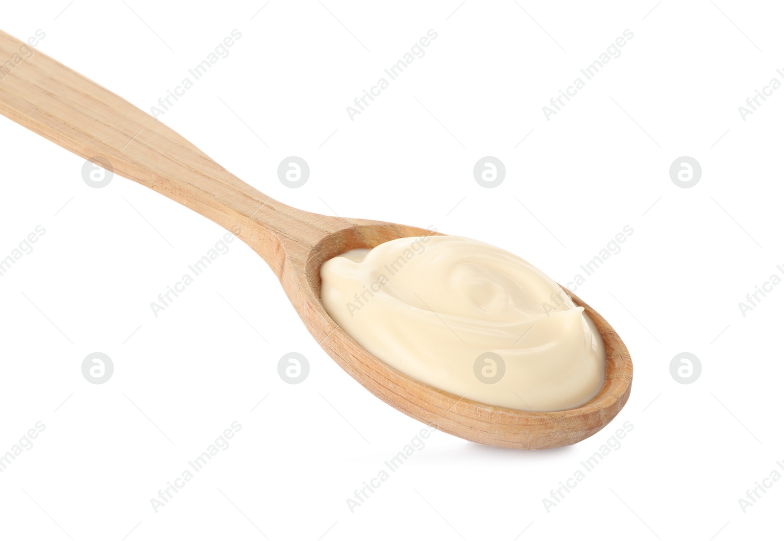 Photo of Wooden spoon with tasty mayonnaise isolated on white