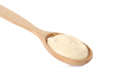 Wooden spoon with tasty mayonnaise isolated on white