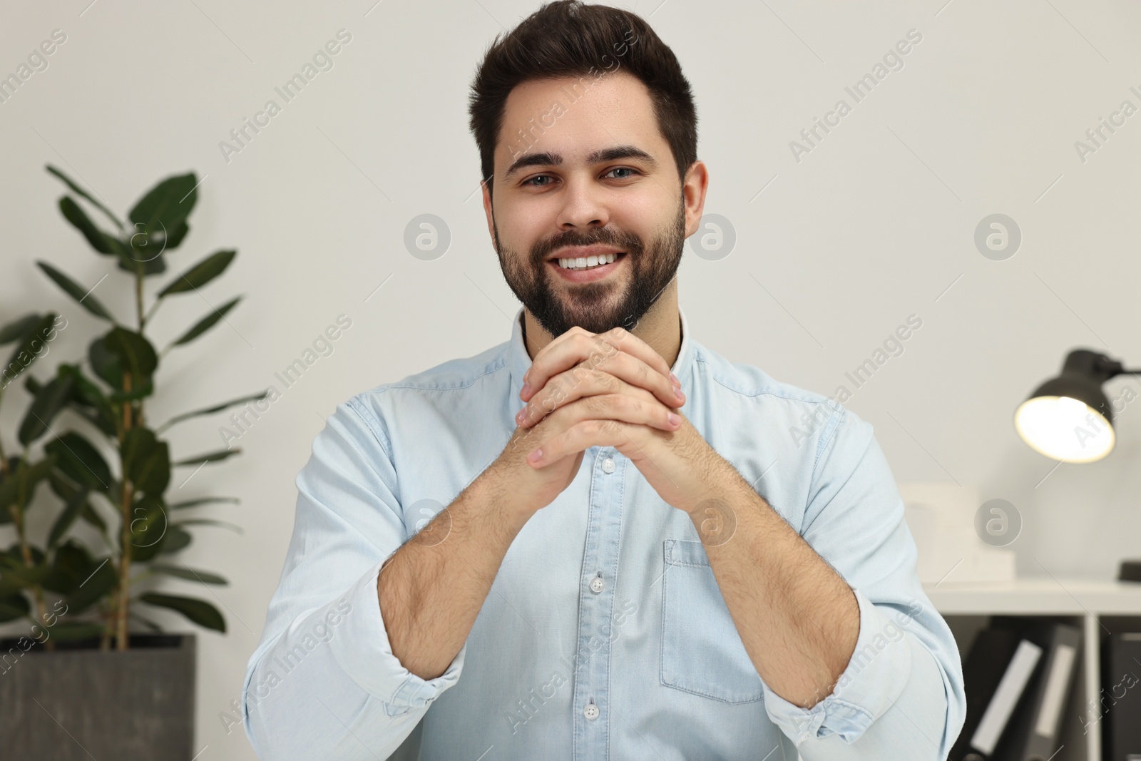 Photo of Young man having video chat indoors, view from web camera