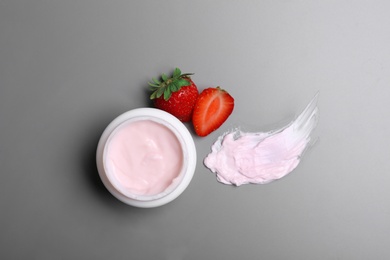 Photo of Flat lay composition with jar of body cream on grey background