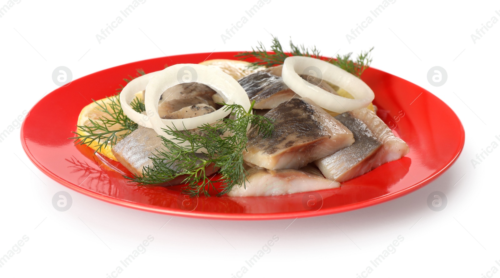 Photo of Red plate with delicious salted herring slices, onion rings and dill isolated on white