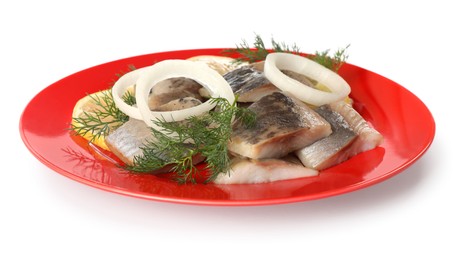 Red plate with delicious salted herring slices, onion rings and dill isolated on white