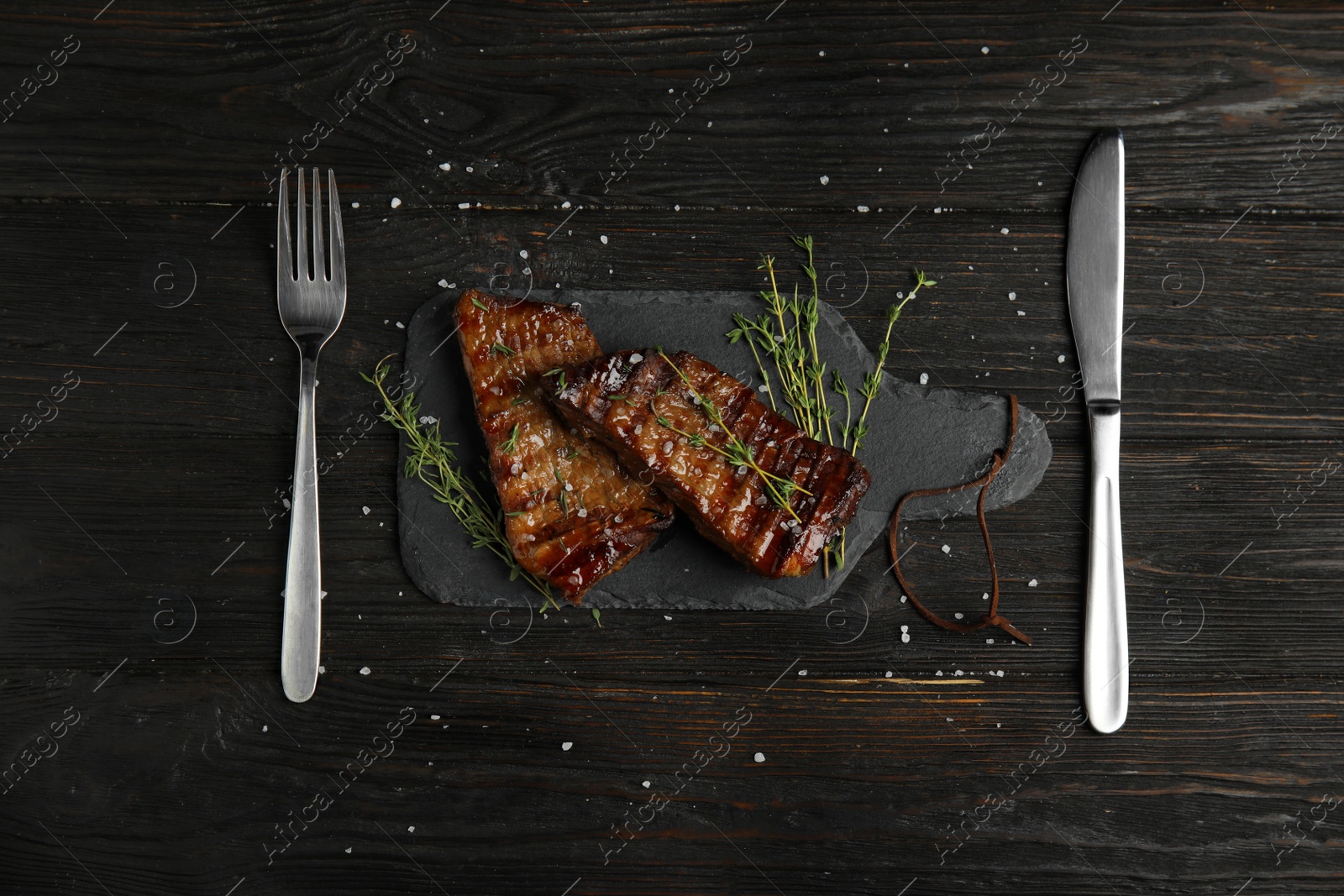 Photo of Flat lay composition with grilled meat on wooden table