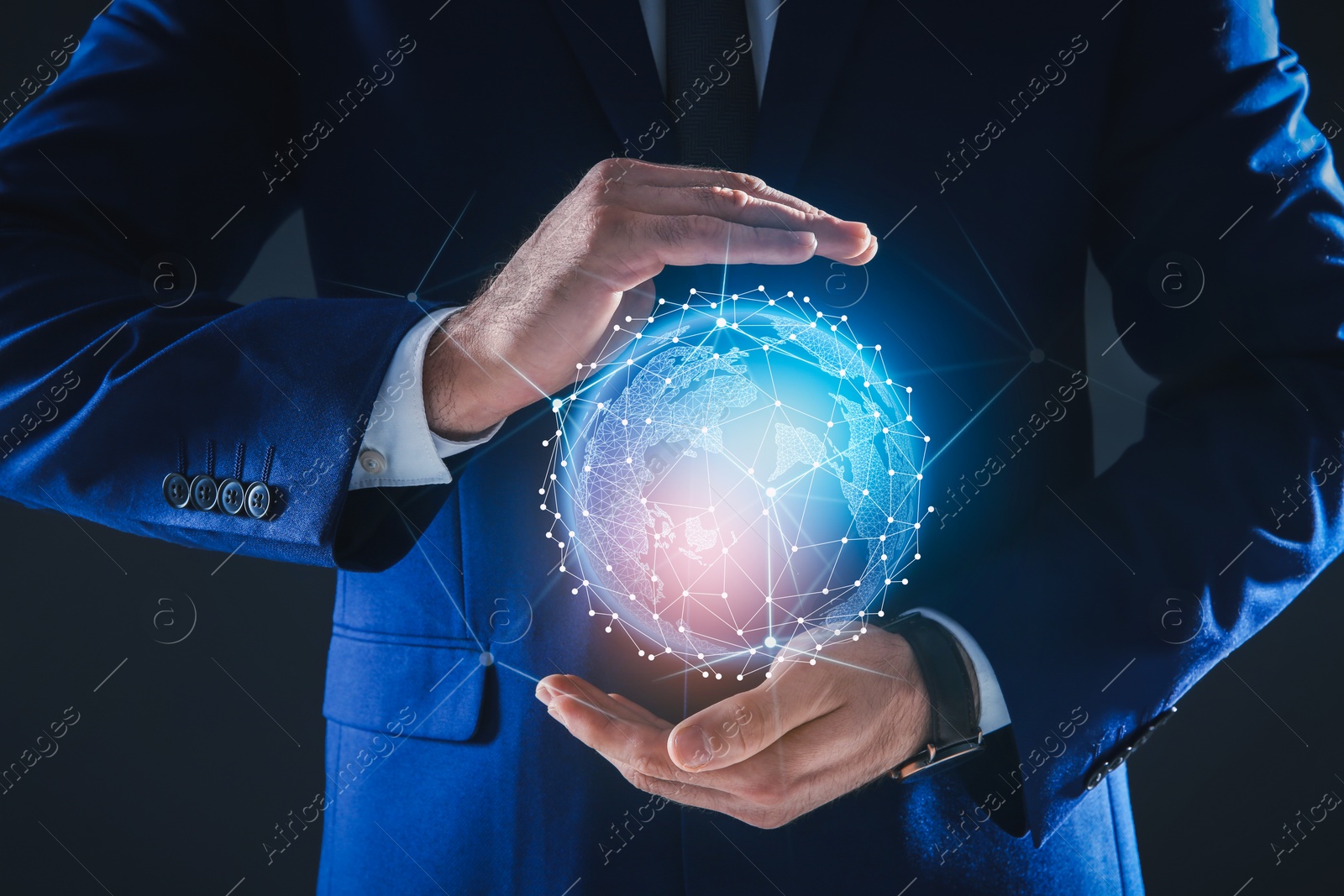 Image of Global innovation. Businessman holding virtual planet on black background, closeup