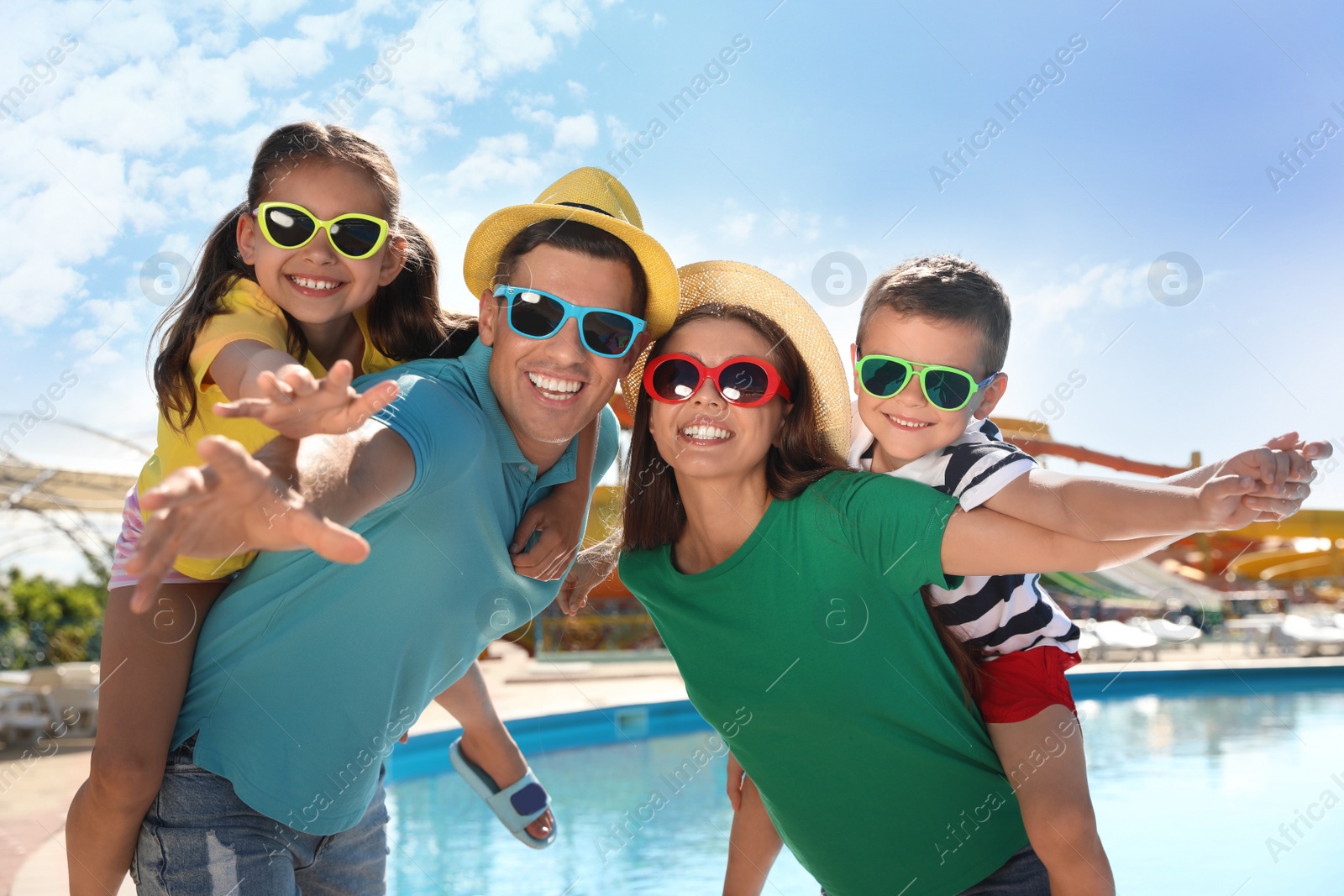 Photo of Happy family at water park. Summer vacation