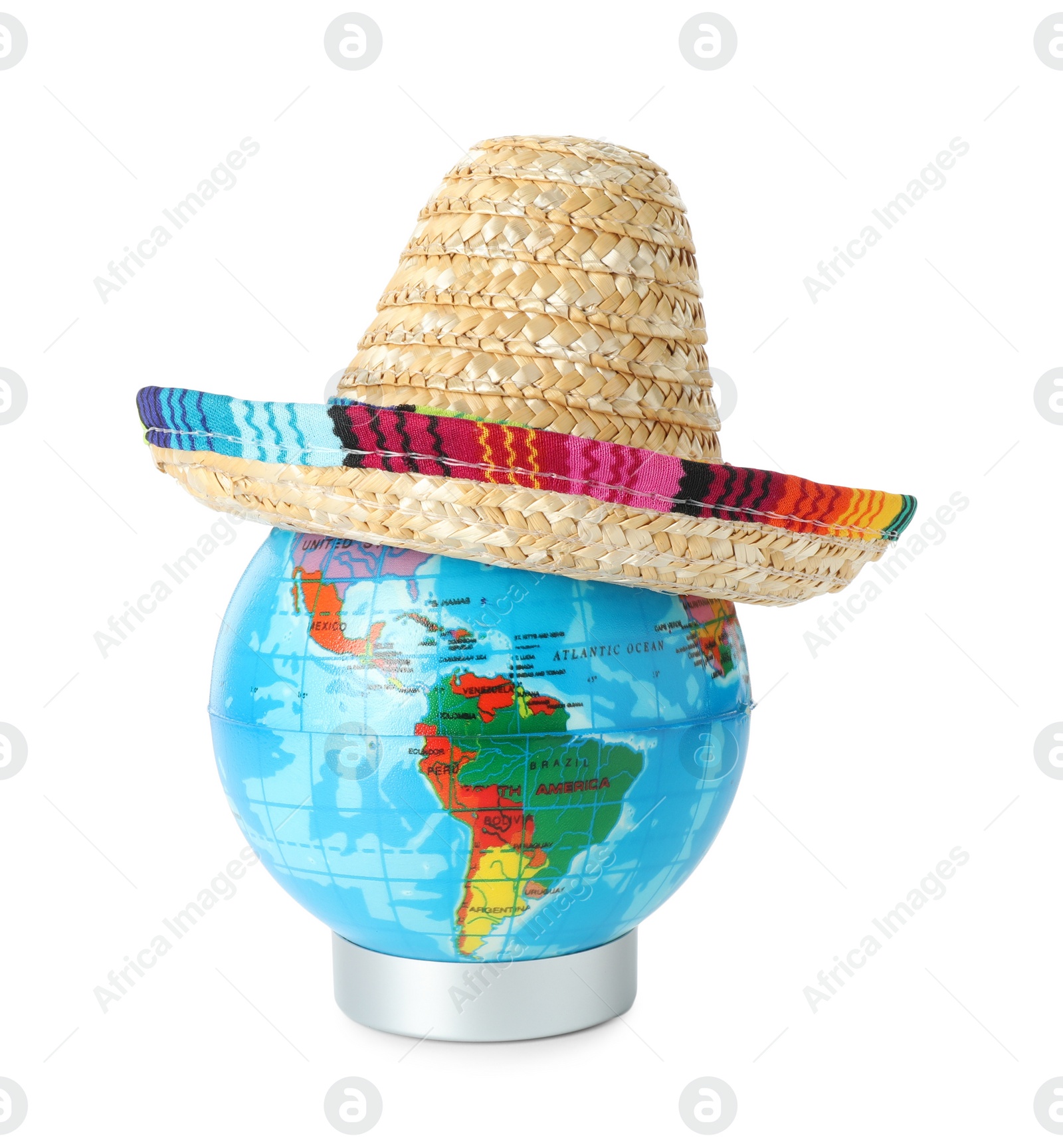 Photo of Globe with Mexican sombrero hat isolated on white