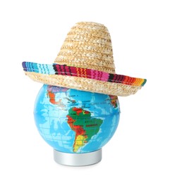 Photo of Globe with Mexican sombrero hat isolated on white