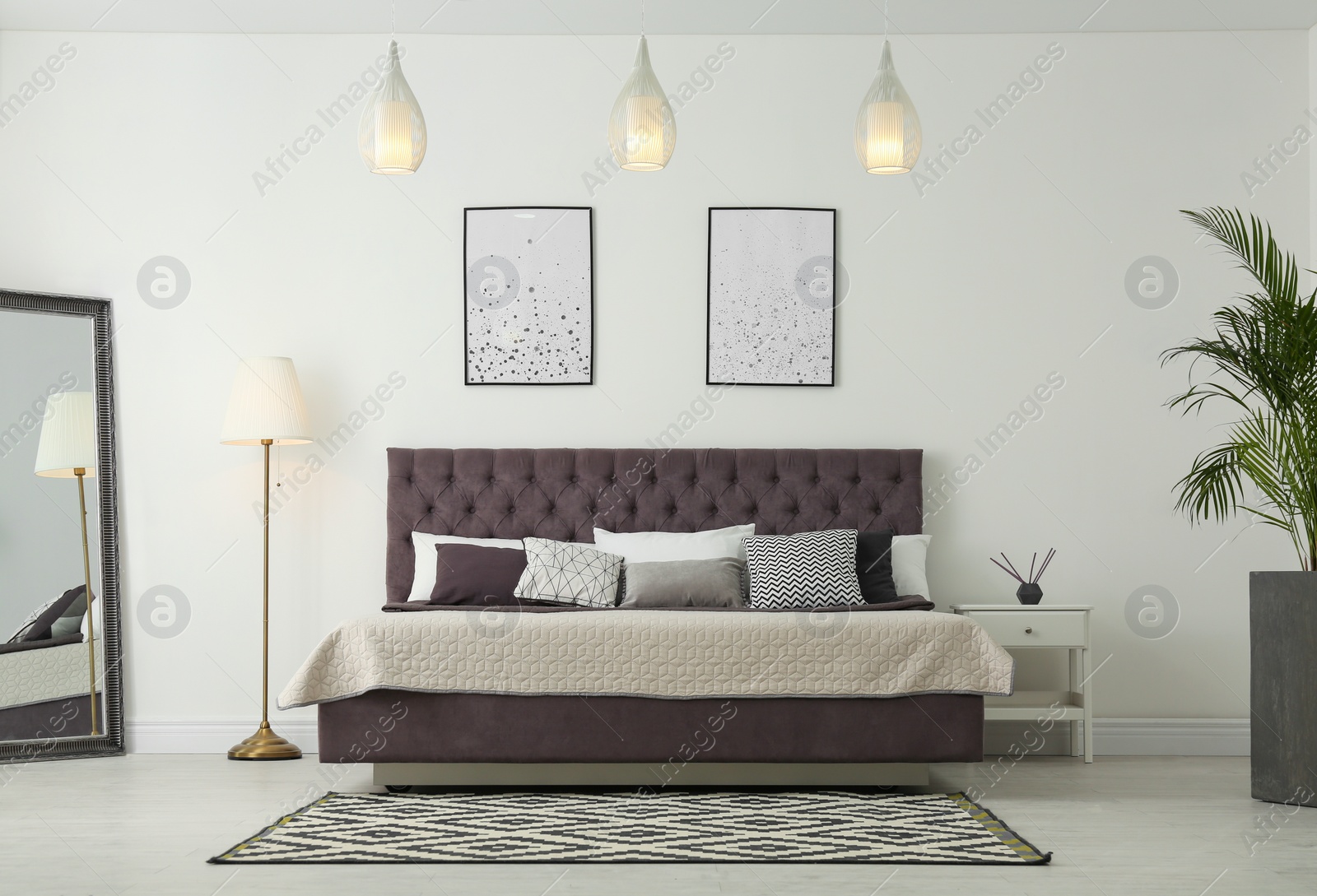 Photo of Elegant interior of modern comfortable bedroom with mirror