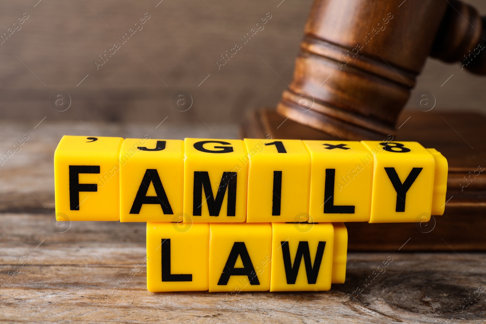 Photo of Cubes with words Family Law and gavel on wooden table