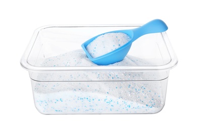 Container and measuring scoop with laundry detergent on white background